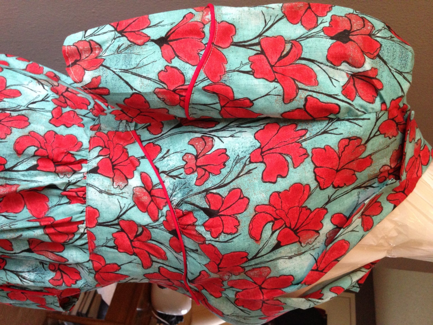 Newly Handmade, 1970's red and blue floral dress with piping, pockets, and sash