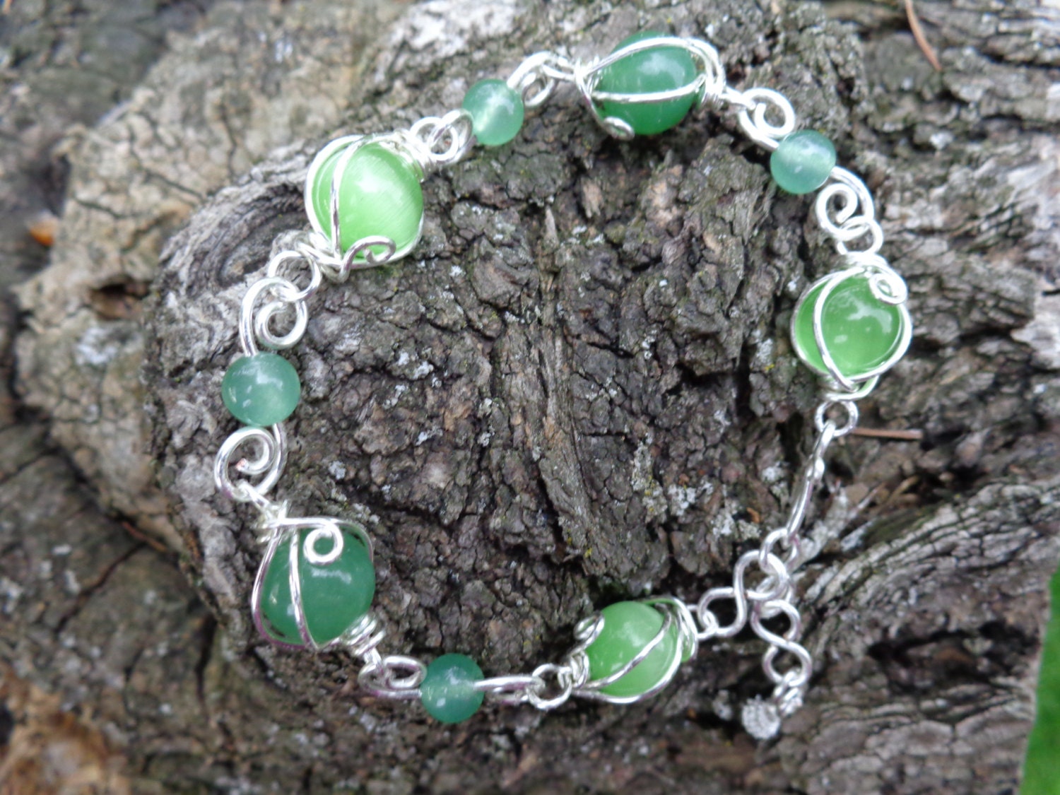 Aventurine gemstones and cats eye bracelet, wire wrapped, handmade by Iris Jewelry Creations.