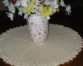 Table centerpiece, crocheted doily 20 in diam, cream, dainty with pretty edges.