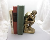 The Thinker. Single brass bookend or doorstop from the 1920s featuring famous Rodin sculpture