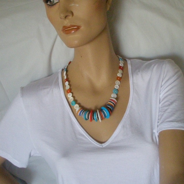 Multi-coloured stacked button necklace. White, turquoise, orange.