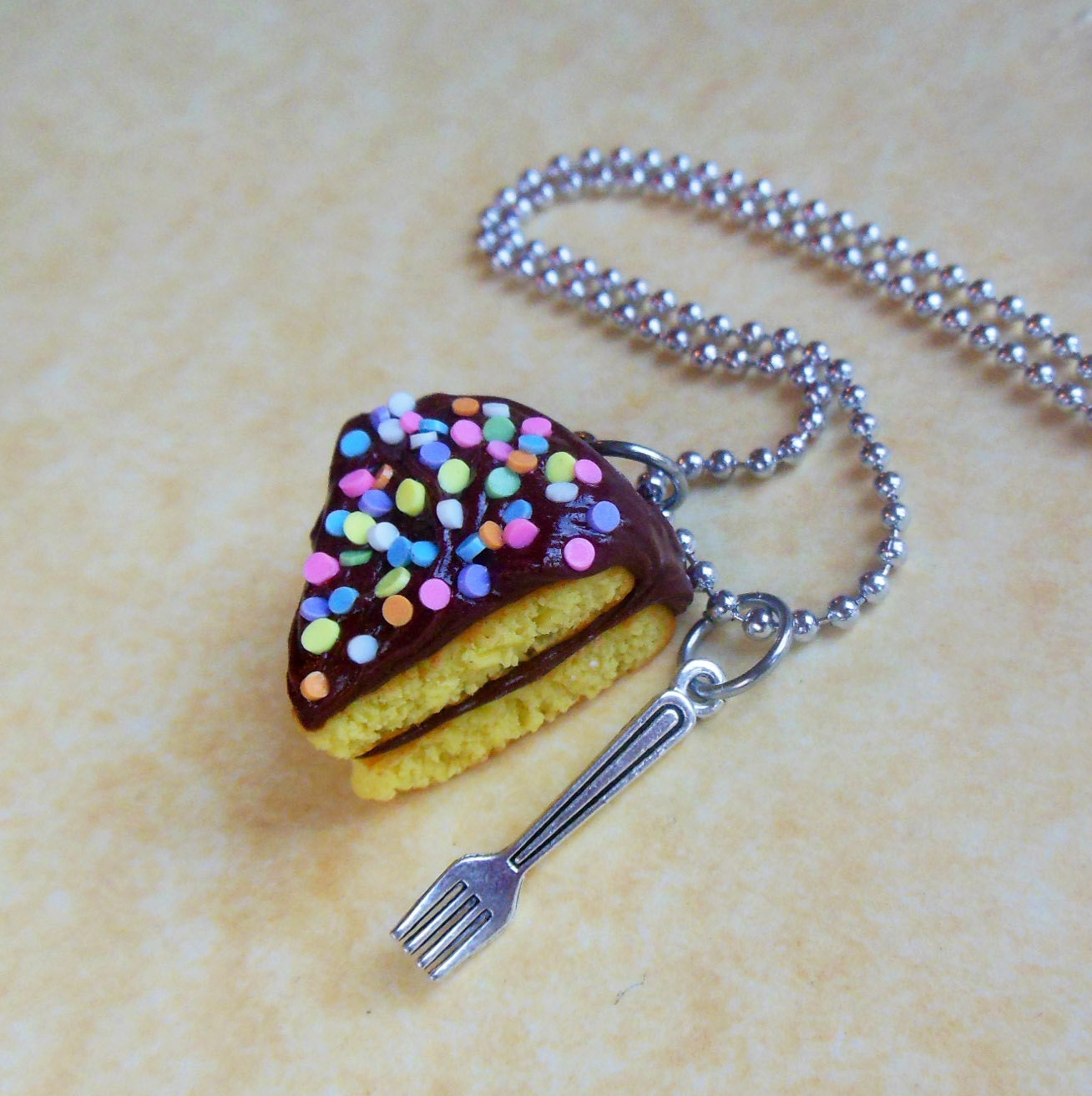 chocolate frosted yellow cake slice with fork charm necklace polymer clay