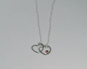 Sterling Silver Eclipsed Hearts Pendant Necklace with Orange Cubic Zirconia Stone