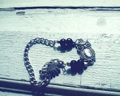Silver chain, owl and black beads bracelet