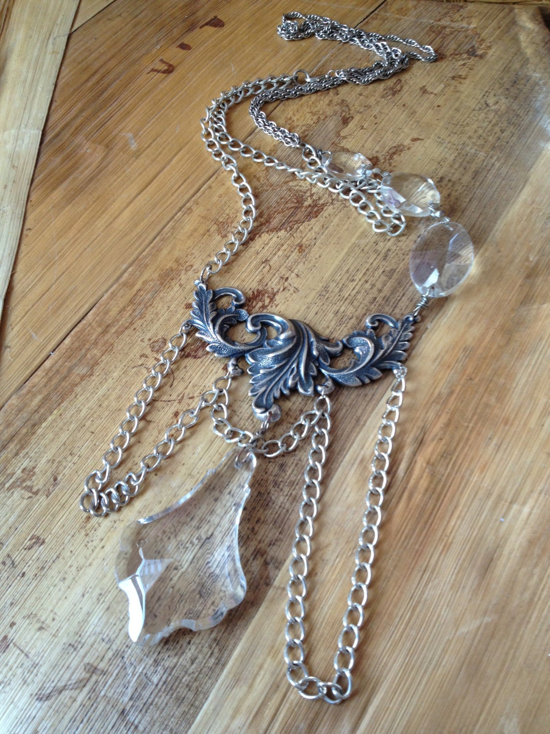 Ornate leaf finding embelished with chain and clear crystals necklace
