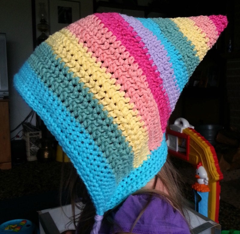 Crocheted rainbow hood with braided ties