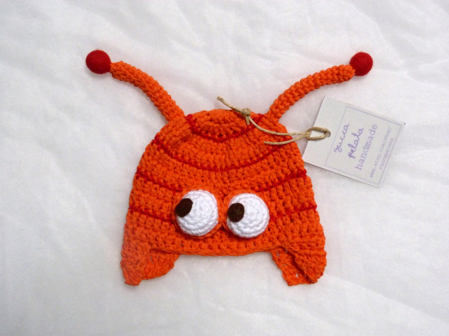 caterpillar hat in orange and red with earflaps