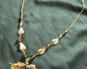Gold leaf and crystal necklace with olive cabochon pendant