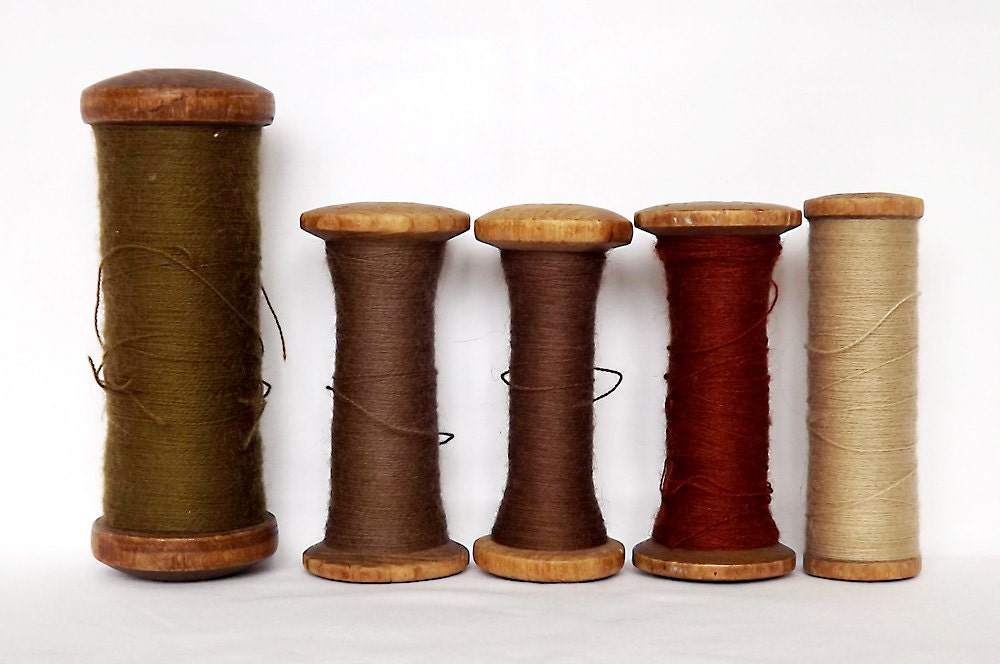 Five wooden French industrial spools with wool thread