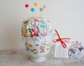 Handmade teacup pincushion with floral pins, sewing accessories, floral teacup pincushion