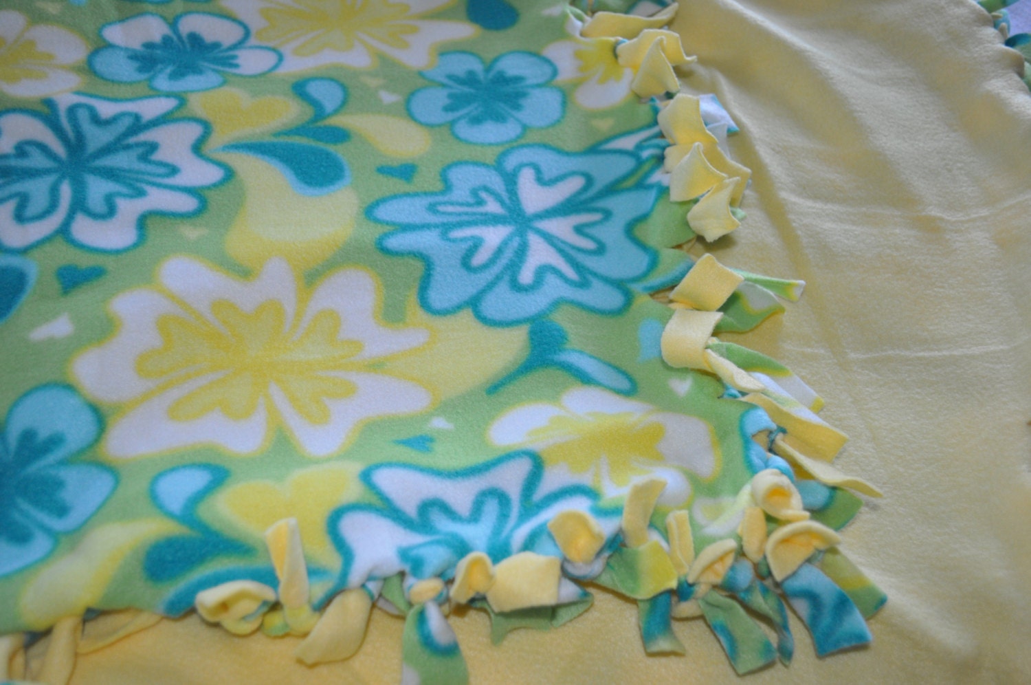 Flower yellow, blue, green, aquamarine tie/fringe fleece blanket with white background for toddler, ready to ship