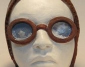 Aviator vintage style female face - white ceramic wall sculpture with mixed media collage by Carrianne Hendrickson.