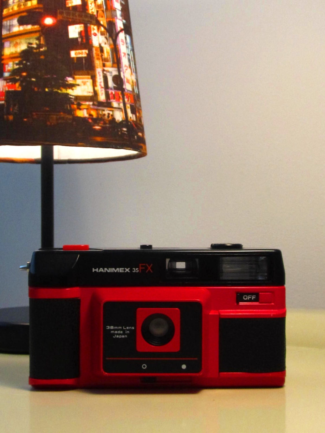 Vintage Hanimex camera Lomo Retro style in black and red color