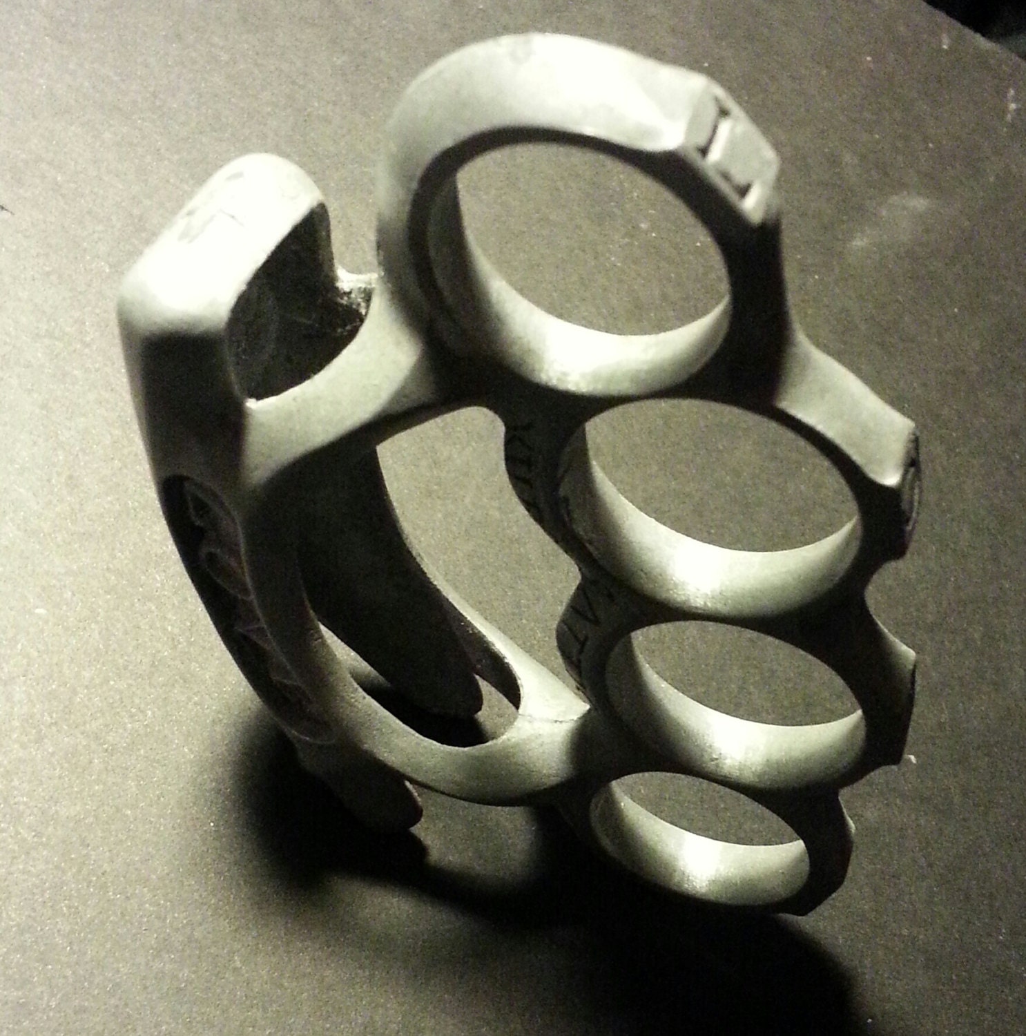 The LOVE Brass Knuckle Lighter Sleeve Aluminum Resin Sculp -