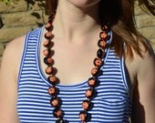 Vintage Black and Coral Hawaiian Seed Necklace Hand Painted Hibiscus Flowers Kukui Nut Polynesian Red Orange Summer Tropical lei Jewelry