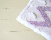 soft pillow in white & pastel pink colors, handwoven home decor from wool and acrylics with playful ornament, ethnic lines on the back