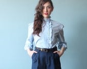 blue ruffled secretary blouse / light blue top (s/m)