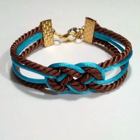 Brown and aqua blue knotted nautical rope bracelet with gold anchor charm
