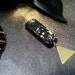 The medals - brooch black and gold