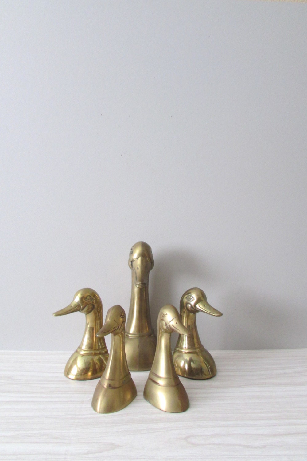 COLLECTION of brass mid century regal duck head office bookends