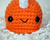SMALL-sized Ned Narwhal Amigurumi, pictured in tangerine, also available crocheted in lavender and aqua