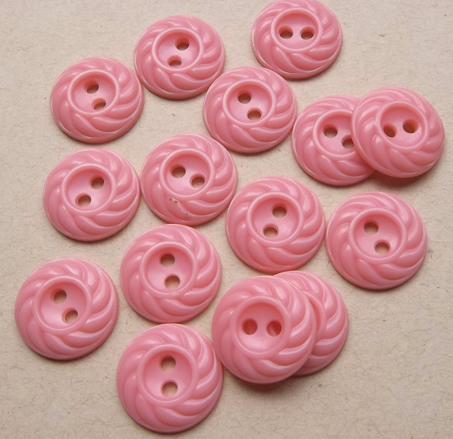 vintage buttons of pretty pink plastic two with swirling edge--matching lot of 15