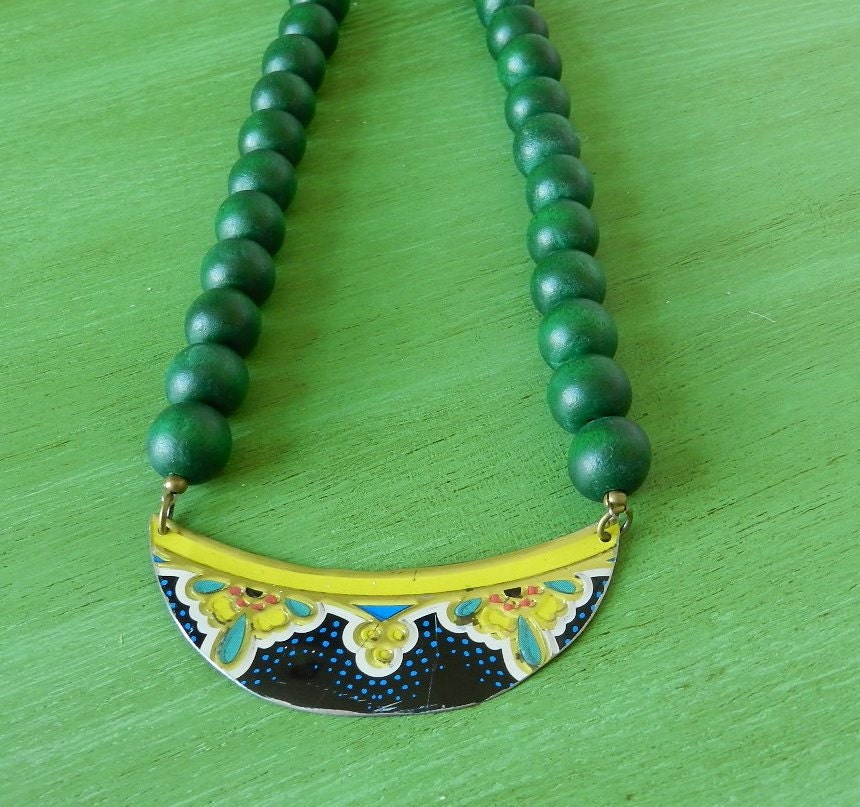 Green wooden beaded choker with vintage tin centerpiece