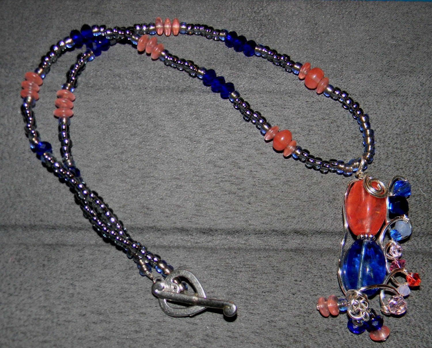 Pink and Blue Quartz Wire Wrapped pendant with crystals and seed beads