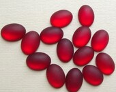 Frosted red plastic cabochons