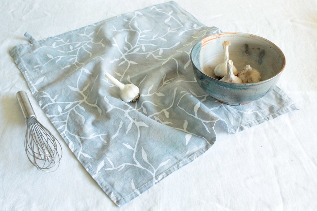 cotton tea towel with a tab. mist gray vines