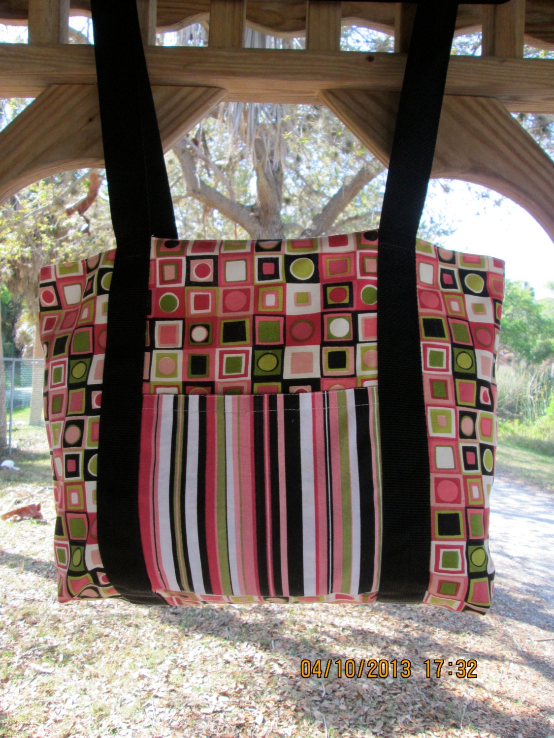 Large cotton tote bag in pink and black retro print with black web straps, front pockets