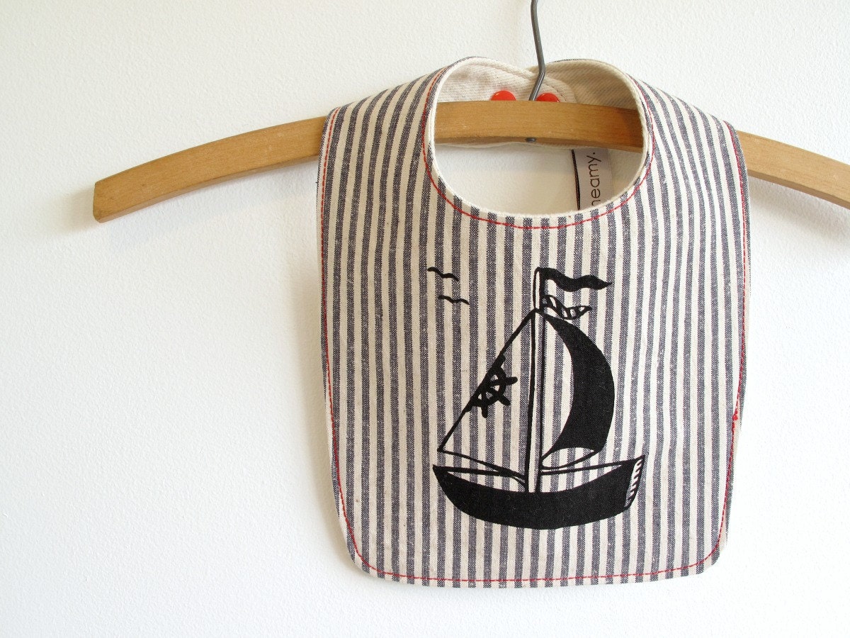 organic bib, nautical sailboat print with red snaps.