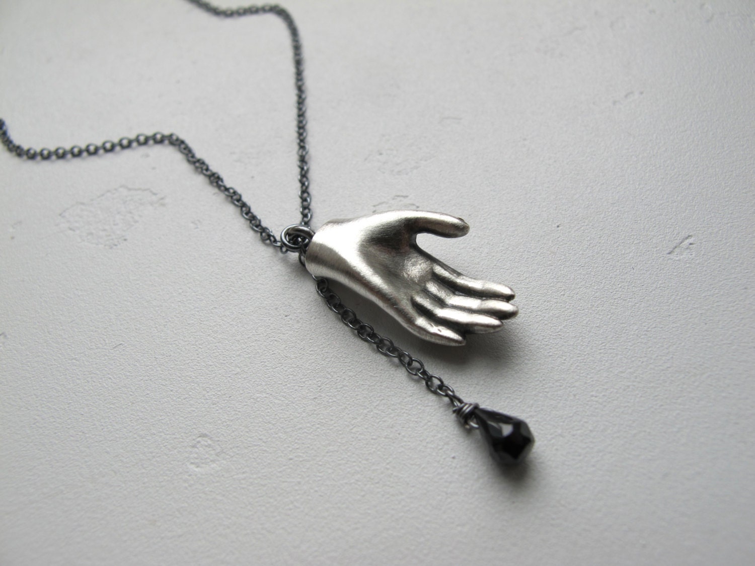 Silver Barbie Doll Hand Necklace with Faceted Black Spinel Gemstone Drop
