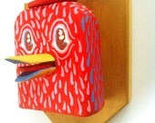Red bird taxidermy head in red hat