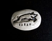 DREAM rock with a pig.
