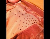 Add Rhinestones to your Illusion Mesh Cutouts....