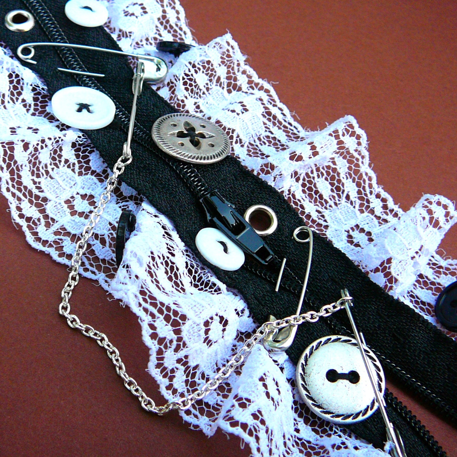 Black and White Bricolage Cuff with Zipper, Buttons, and Lace
