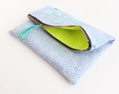 Blue and white geometric print with mint fold over clutch