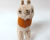 Small Wooly Alpaca in a Pumpkin-Coloured Embroidered Cape
