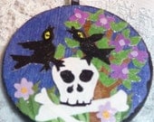 Ravens resting on skull, wood tile necklace