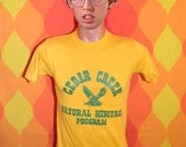 vintage 80s t-shirt CEDAR CREEK eagles school nature heritage tee Small gold soft hand drawn