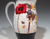 Poppy pitcher with glossy layered glaze and custom decal work.