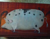 Old red box with primitive pig