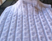 Hand knitted, white baby blanket for a boy or girl