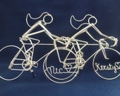 RACING BRIDES: Two Brides Racing Bike Riders Wedding Cake Topper