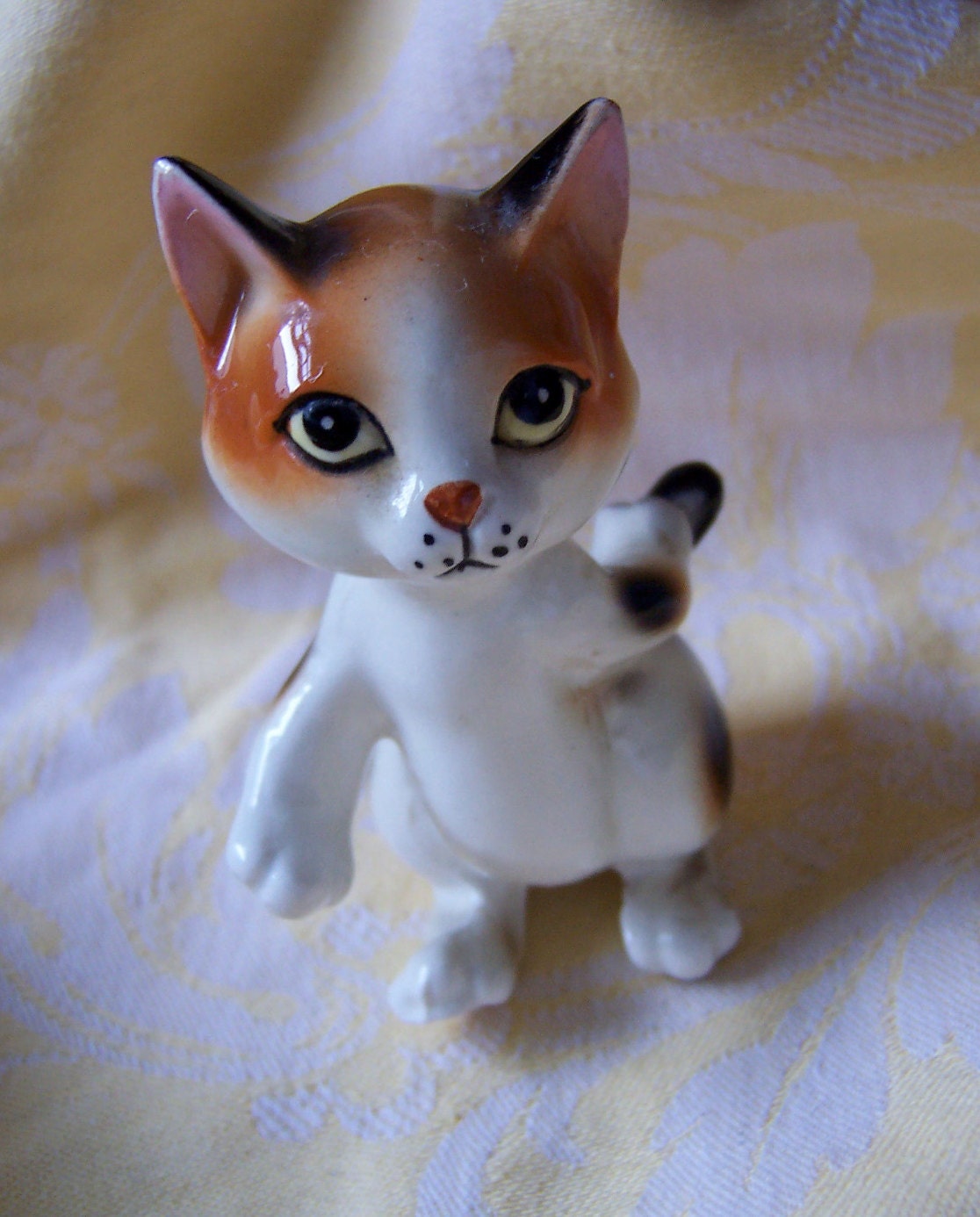 very lovable porcelain kitty figurine