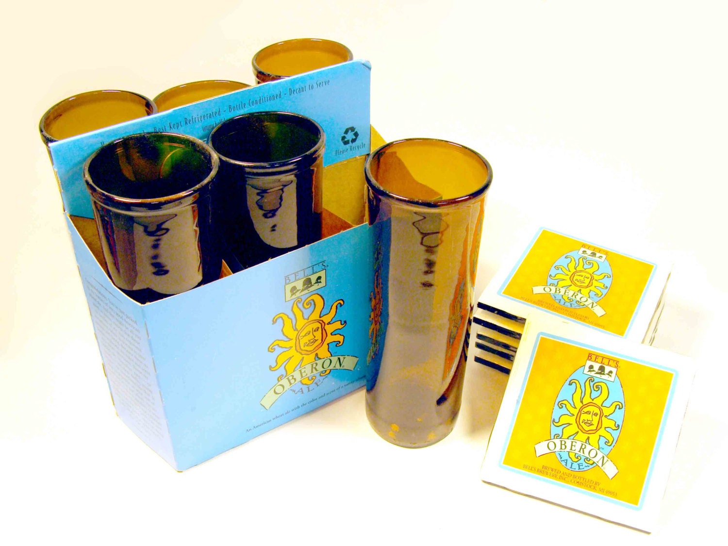 Six Pack Set of Recycled Bell's Oberon Beer Bottle Drinking Glass Cups with six labeled ceramic coasters.