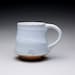 handmade coffee mug, teacup, pottery cup with orange shino and white wood ash glazes