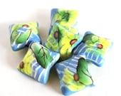 Yellow Flowers on a Blue Pillow Bead White Stripes Polymer Clay
