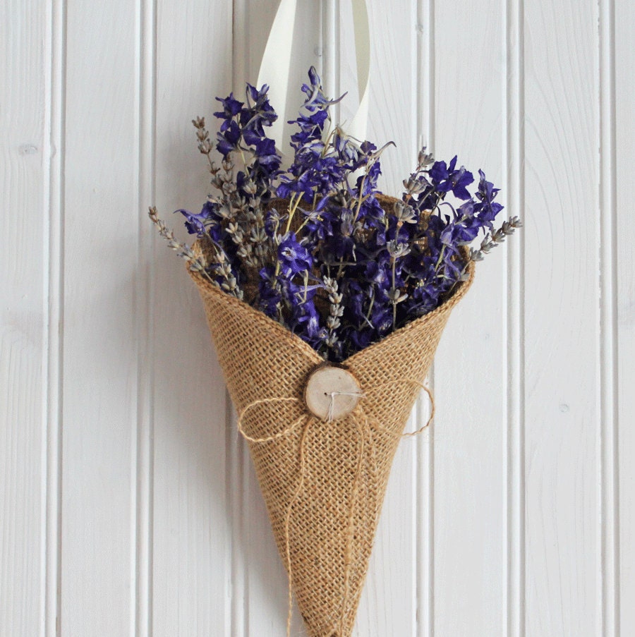 Khaki burlap pew cone with reclaimed wood button / rustic wedding decoration. Handmade by Nutfield Weaver.